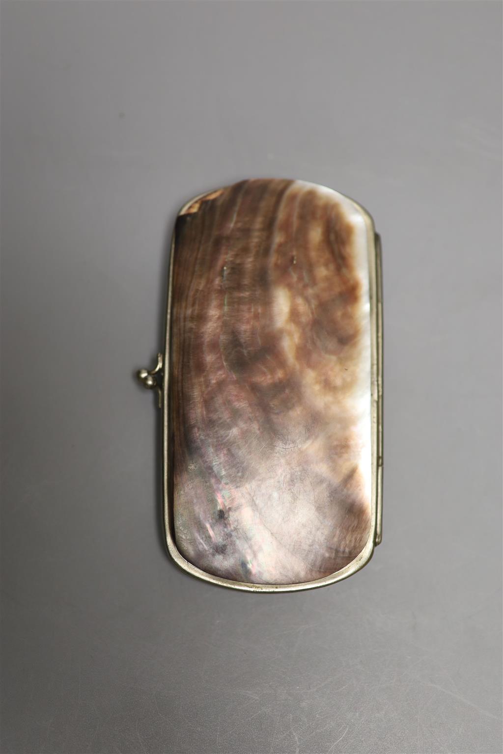 A 19th century mother of pearl figuratively carved purse/case, height 12cm
